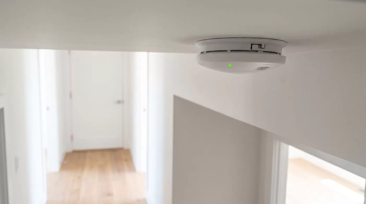 Hardwired smoke and CO detector on a home ceiling